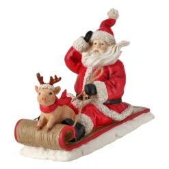 Resin Santa With Pig On Sled Figurine